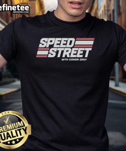 Conor Daly wearing the Top Speed Street T-Shirt, showcasing racing spirit and style in vibrant colors.