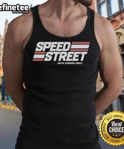 Conor Daly in a tank top on a vibrant street during Top Speed Street event, capturing high-energy racing vibes.
