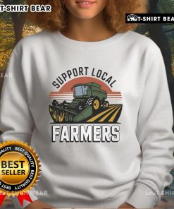 Cozy sweatshirt featuring a tractor design to support local farmers, perfect for showcasing your love for agriculture.