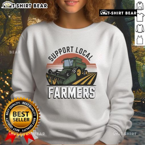Cozy sweatshirt featuring a tractor design to support local farmers, perfect for showcasing your love for agriculture.
