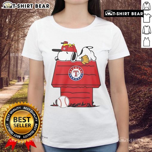 Alt Text: Top Texas Rangers Snoopy Woodstock House Ladies Tee featuring vibrant graphics and a comfortable fit for fans.