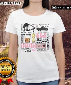 Top Wallen Western Luke Combs Bumper 'Sand In My Wasted On You' Country Music Ladies Tee displayed on a hanger.