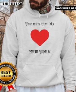 Cozy Top You Taste Just Like New York Hoodie displayed on a rustic background, perfect for urban fashion lovers.