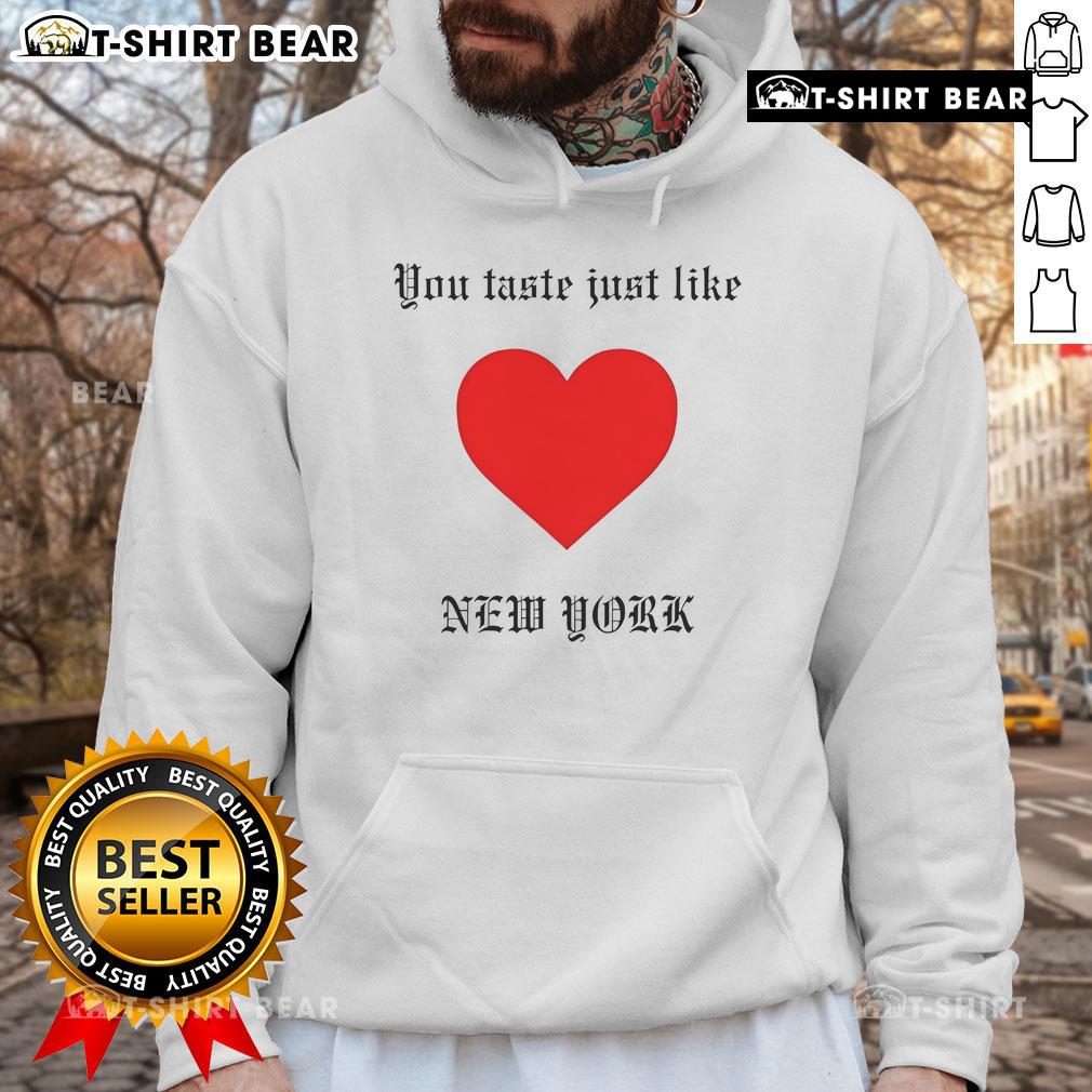 Top You Taste Just Like New York Hoodie Cozy Top You Taste Just Like New York Hoodie displayed on a rustic background, perfect for urban fashion lovers.