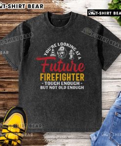 Alt Text: Future firefighter in a washed t-shirt, showcasing strength and youth, ready for a brave career in firefighting.