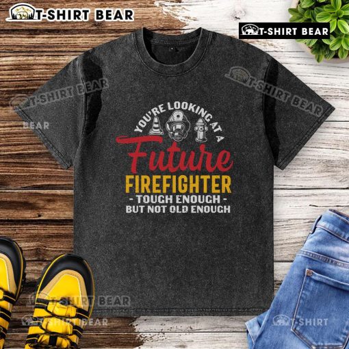 Alt Text: Future firefighter in a washed t-shirt, showcasing strength and youth, ready for a brave career in firefighting.