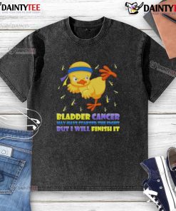 Awesome cartoon chick delivering a karate kick, symbolizing strength in the fight against bladder cancer on a washed T-shirt.