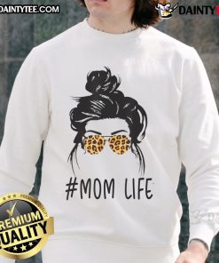 Stylish mom wearing leopard pattern shades and a cool messy bun sweatshirt, embodying awesome classy mom life.