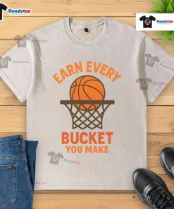 Awesome Earn Every Bucket You Make Washed T-Shirt featuring a stylish design, perfect for casual wear and sports enthusiasts.