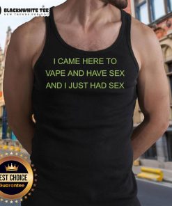 Person wearing 'I Came Here To Vape And Have Sex' tank top, enjoying a relaxed atmosphere at a vape lounge.
