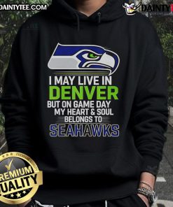 Man wearing Seattle Seahawks hoodie, showcasing pride on game day, despite living in Denver.