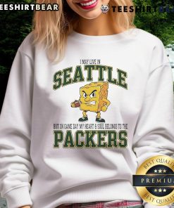 Green Bay Packers sweatshirt worn proudly in Seattle, showcasing team spirit on game day.