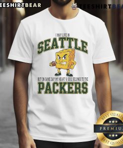 Green Bay Packers t-shirt with 'I may live in Seattle but on game day, my heart belongs to Packers' text design.