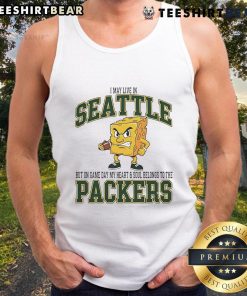 Alt Text: Woman in a Green Bay Packers tank top, showcasing team spirit on game day in Seattle.
