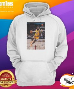 Alt Text: LeBron James in a striking pose wearing a Los Angeles Lakers hoodie, showcasing his iconic Number 23 jersey.