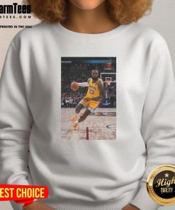 LeBron James in a stylish Los Angeles Lakers sweatshirt, showcasing his iconic Number 23 pose on the court.
