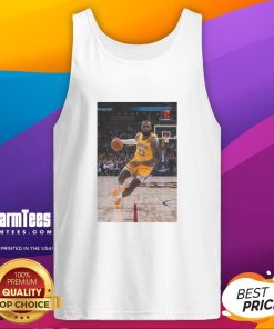 LeBron James in a striking pose wearing a Los Angeles Lakers tank top, showcasing his number 23 jersey.