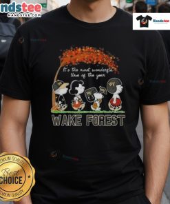 Alt Text: Awesome Peanuts 'It's The Most Wonderful Time Of The Year' Wake Forest T-Shirt featuring festive Snoopy and holiday design.