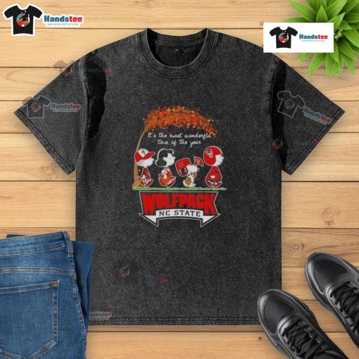 Awesome Peanuts 'It's The Most Wonderful Time Of The Year' NC State Wolfpack washed t-shirt for fans and holiday cheer.