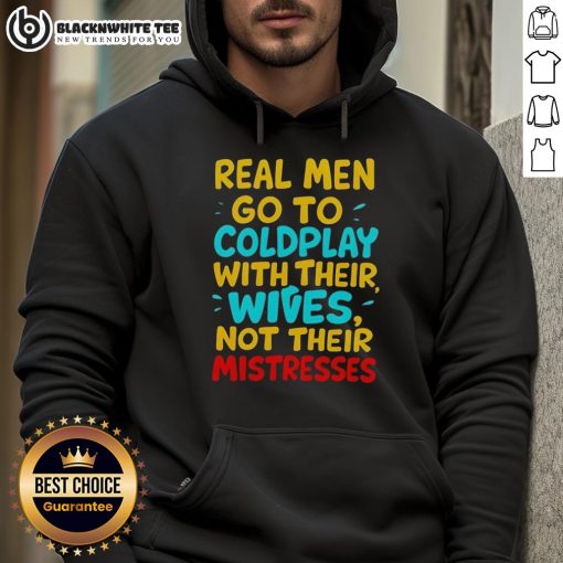 Awesome Real Men Go To Coldplay With Their Wives Hoodie worn by a couple at a concert, showcasing their love for music.