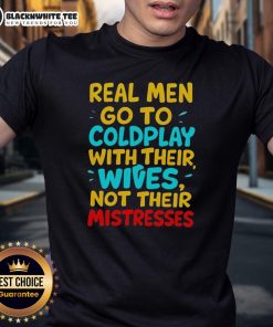 Awesome Real Men Go To Coldplay With Their Wives T-Shirt displayed on a hanger, perfect for concert lovers.