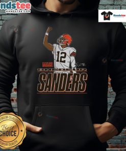 Shedeur Sanders in a Cleveland Browns Believe hoodie, showcasing style and team spirit at a game.
