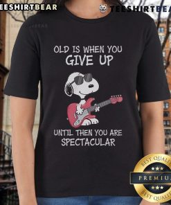 Awesome Snoopy guitar design on a ladies tee with the quote about aging and staying spectacular. Perfect for music lovers!