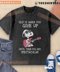 Awesome Snoopy guitar design on a washed t-shirt with 'Old is when you give up' quote, perfect for music lovers.