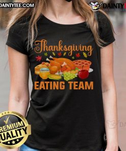 Thanksgiving food lovers team enjoying a festive turkey day feast in matching ladies tees, celebrating together.