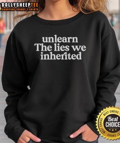 Alt Text: Stylish 'Unlearn The Lies We Inherited' sweatshirt in a cozy setting, perfect for casual wear and self-expression.