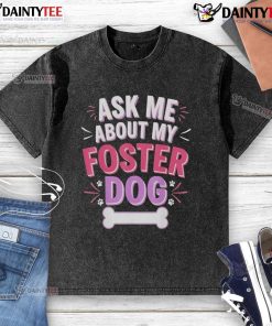 Cute 'Ask Me About My Foster Dog' washed t-shirt displayed on a hanger, perfect for dog lovers and foster pet advocates.