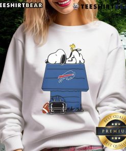 Cute Buffalo Bills football sweatshirt featuring Snoopy and Woodstock from The Peanuts, perfect for fans.
