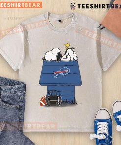 Alt Text: Cute Buffalo Bills football Snoopy and Woodstock design on a washed t-shirt, perfect for Peanuts fans and sports lovers.