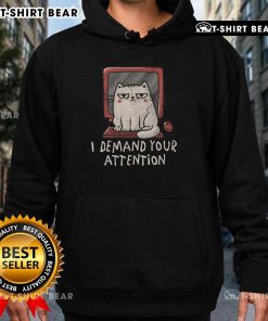Cute cat on keyboard wearing 'I Demand Your Attention' hoodie, perfect for cat lovers and cozy fashion enthusiasts.