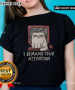 Alt Text: Cute cat sitting on a keyboard with a playful expression, perfect for the I Demand Your Attention ladies' tee design.