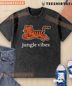 Man wearing a Cute Cincinnati Bengals Jungle Vibes Run Wild Washed T-Shirt, showcasing team spirit in a vibrant setting.