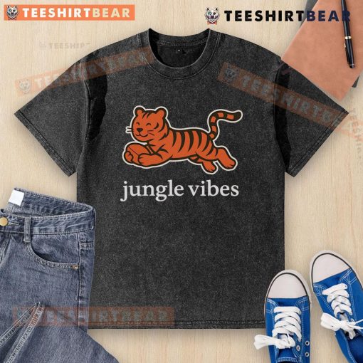 Man wearing a Cute Cincinnati Bengals Jungle Vibes Run Wild Washed T-Shirt, showcasing team spirit in a vibrant setting.
