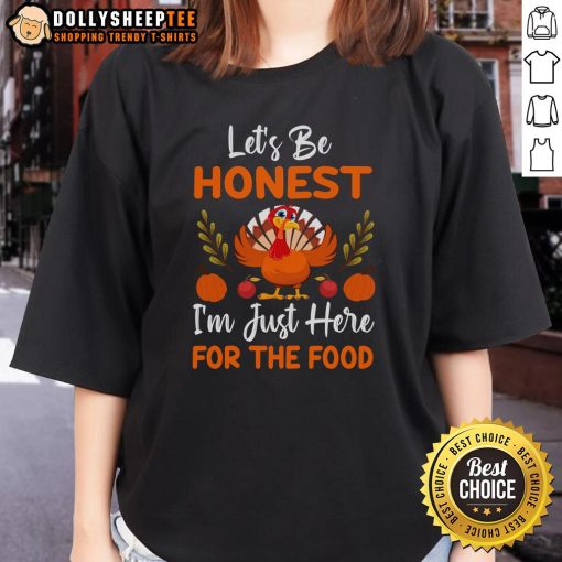 Cute Thanksgiving turkey ladies tee with the phrase 'Let's Be Honest, I'm Just Here for the Food' printed on it.