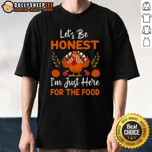 Alt Text: Cute Thanksgiving turkey t-shirt with 'Let's Be Honest I'm Just Here For The Food' slogan, perfect for holiday celebrations.