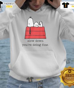 Cute motivational Snoopy hoodie with 'Slow Down, You're Doing Fine' text, perfect for casual and uplifting wear.