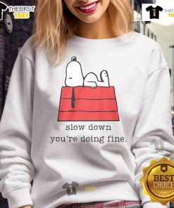Alt Text: Cute motivational Snoopy sweatshirt with 'Slow Down, You're Doing Fine' text for a cozy, inspiring look.