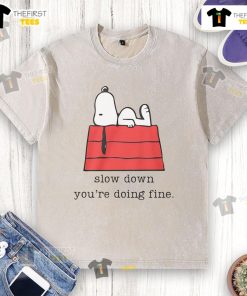 Cute motivational Snoopy 'Slow Down, Youre Doing Fine' washed t-shirt showcasing a relaxed, inspiring design.