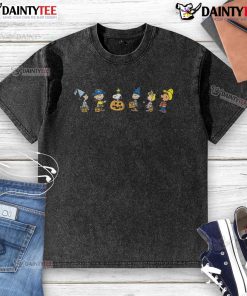 Alt Text: Cute Peanuts Halloween costumes on a washed T-shirt featuring Charlie Brown and Snoopy in festive attire.