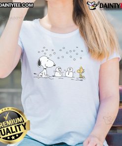 Alt Text: Cute Peanuts Snoopy and Woodstock winter snowman graphic on a ladies tee, perfect for cozy holiday outfits.