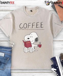 Alt Text: Cute Snoopy coffee graphic on a washed t-shirt, showcasing Christ offers forgiveness for everyone everywhere.