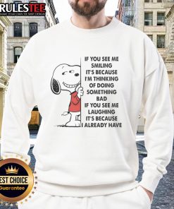 Alt Text: Cute Snoopy sweatshirt featuring the phrase If you see me smiling, it's because I'm thinking of doing something bad.
