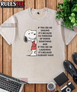 Alt Text: Cute Snoopy t-shirt with 'If you see me smiling, it's because I'm thinking of doing something bad' design.
