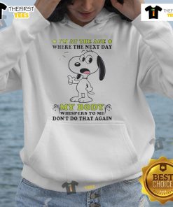 Cute Snoopy hoodie featuring the phrase 'I'm at the age where my body whispers dont do that again.'