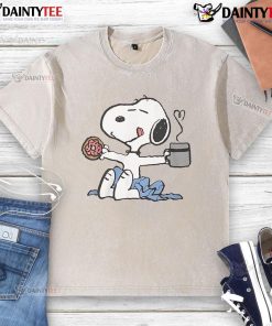 Cute Snoopy lounging on a washed t-shirt, perfect for a lazy morning vibe and cozy style.