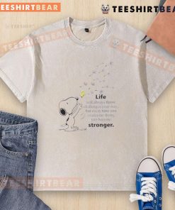 Cute Snoopy graphic on a washed t-shirt with the quote about overcoming challenges and becoming stronger.